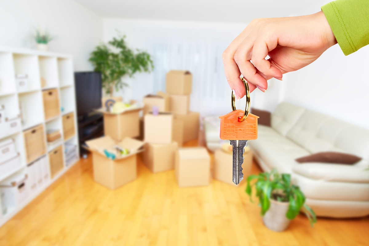 woman holding keys in vacant unit